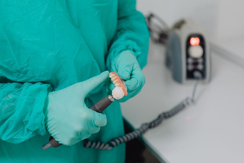 dentist performing precision denture reline dentist performing precision denture reline