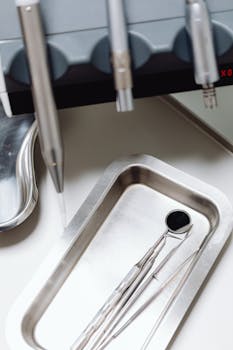 A vertical shot of dental instruments in a clinic setting, showcasing sterility and precision.