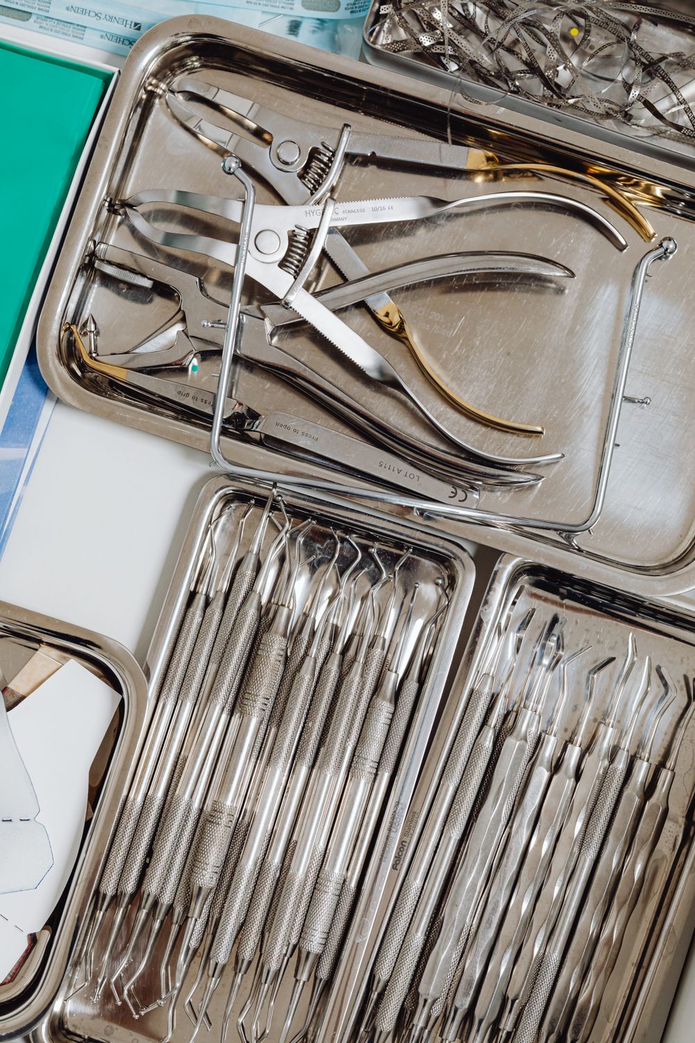 Organized stainless steel surgical instruments arranged on a tray, ready for quality inspection