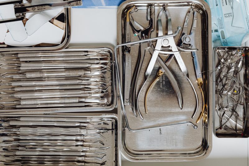 Sterile dental tools arranged on metal trays