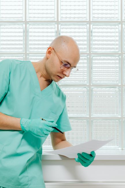 A patient reviewing clinical trial data to assess experimental medical treatments