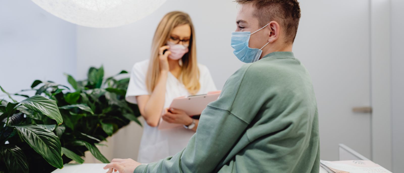 A patient and a clinician talking through imaging at an appointment