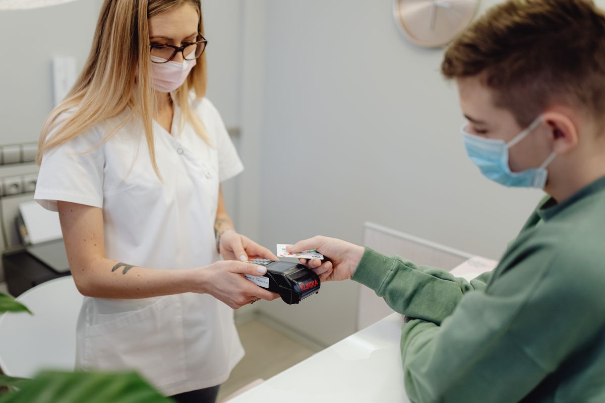 Patient discussing payment options at the front desk