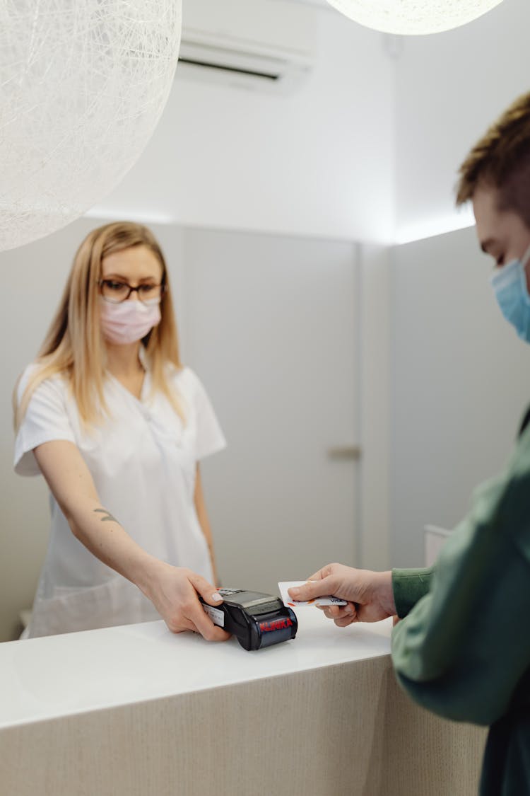 Man And Woman Standing At The Counter