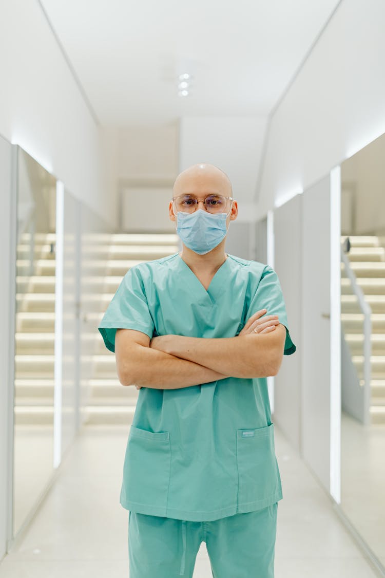 Health Worker In A Teal Scrub Suit 