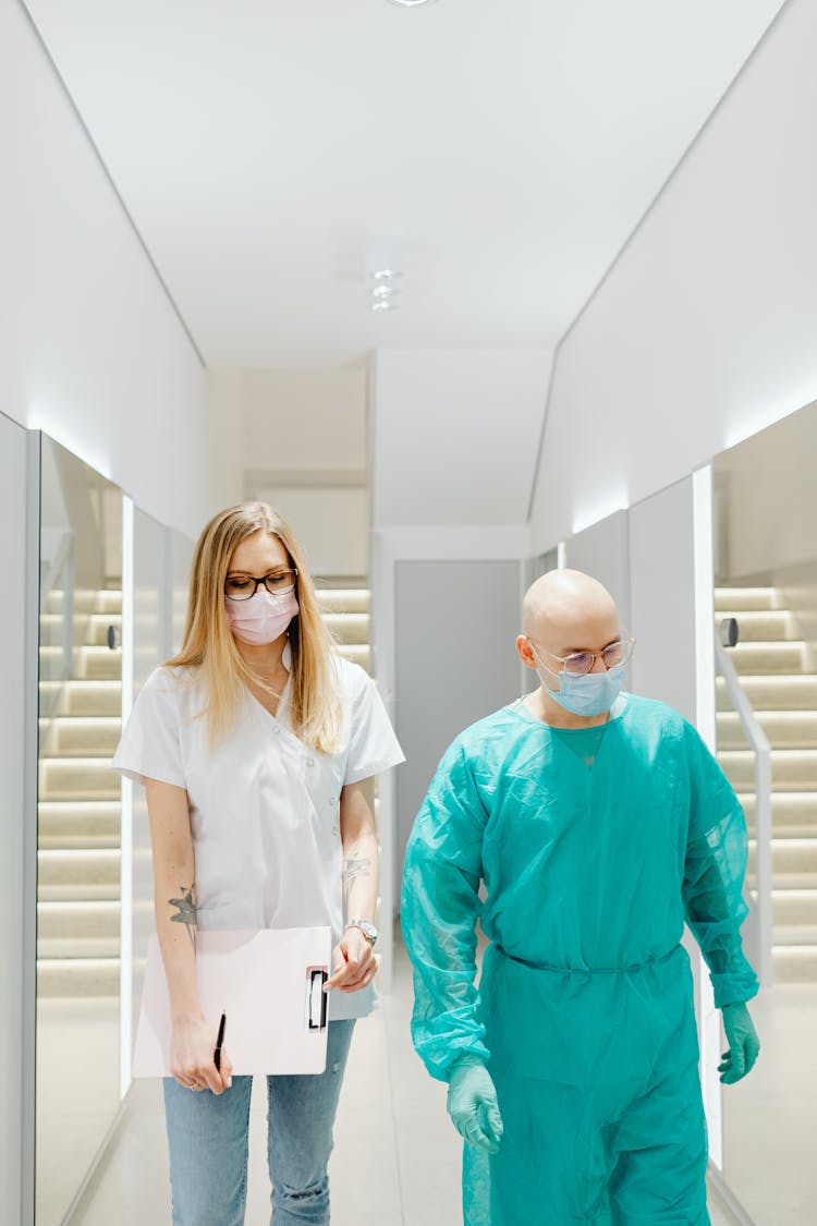 Man And Woman Walking On The Hallway