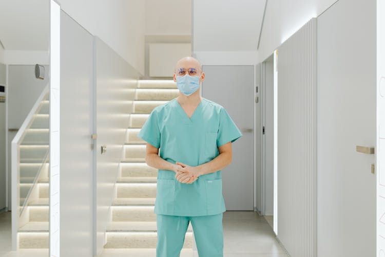 Health Worker In A Teal Scrub Suit 