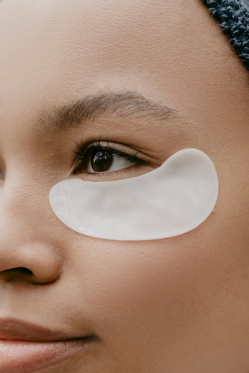 A Woman's Face With White Eye Patch