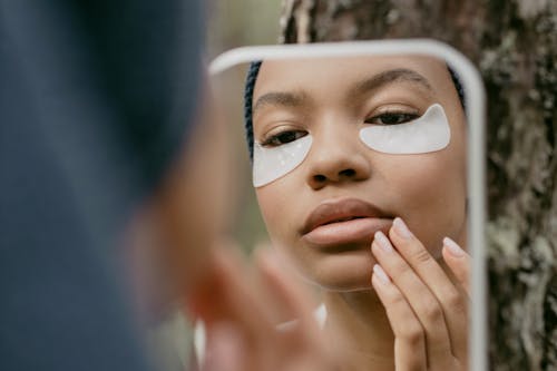 A Woman Looking at the Mirror