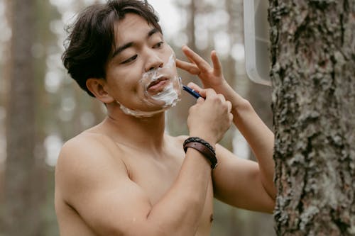 Kostnadsfri bild av ansiktsvård, asiatisk man, bar överkropp