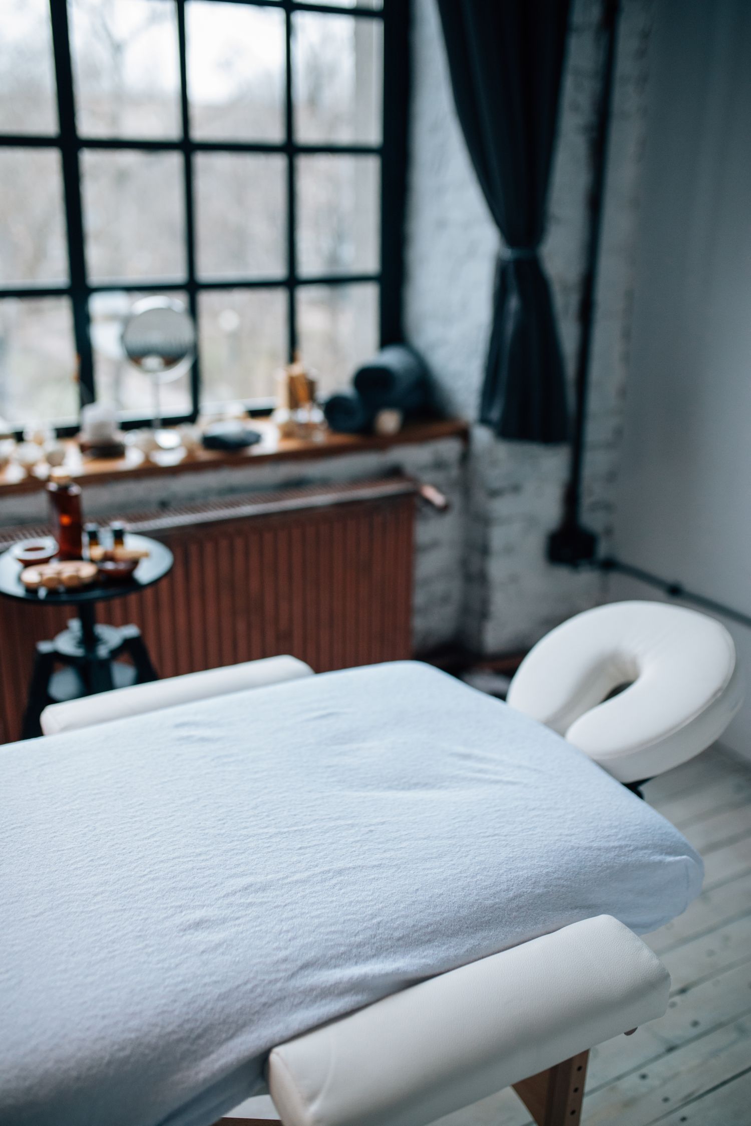 Calm massage treatment room with natural light