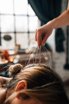 A soothing head massage session indoors, promoting relaxation and self-care.