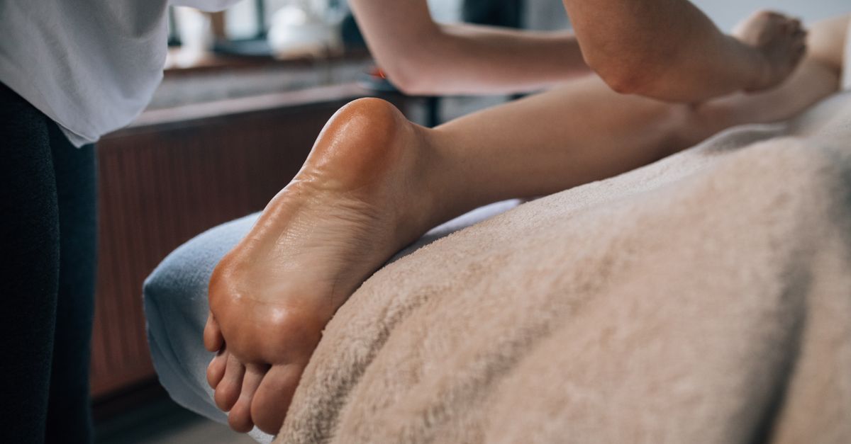 A soothing foot massage in a calming indoor setting, promoting relaxation and self-care.