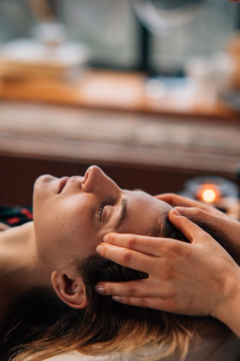 Woman enjoying a relaxing face massage indoors