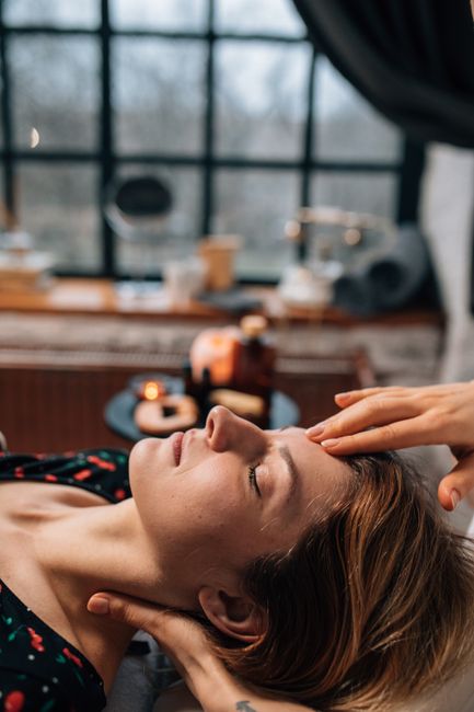 woman massaging temple relaxation