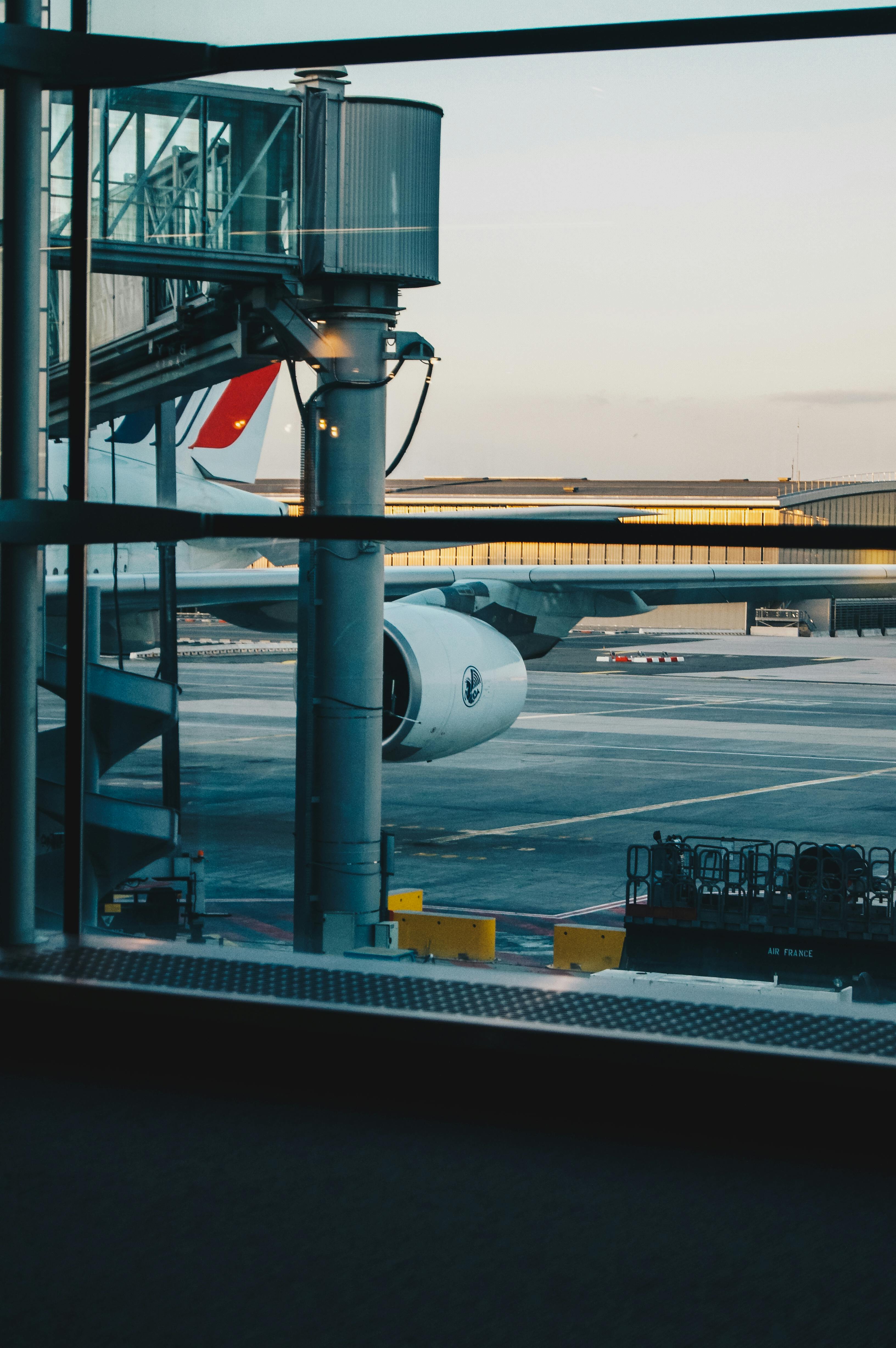 Airplanes On Hangar Under Blue Sky · Free Stock Photo