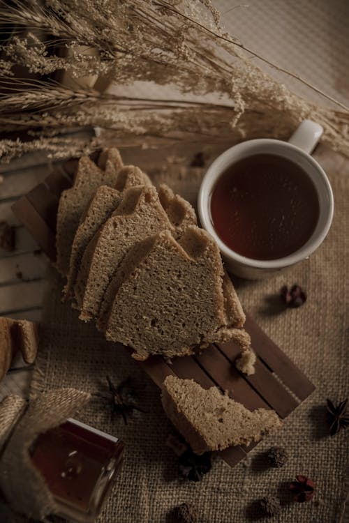 Free Brown Bread Beside Cup of Coffee  Stock Photo