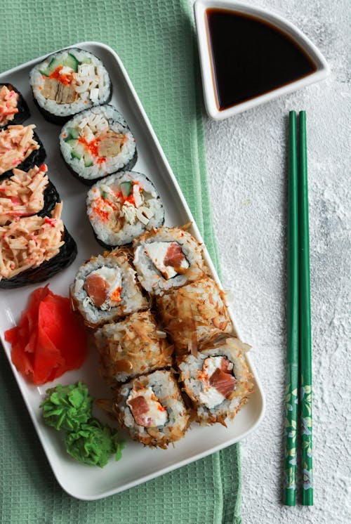 Assorted Sushi With Wasabi and Ginger on a Plate