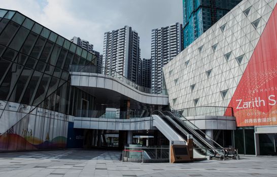 Contemporary urban scene with modern skyscrapers and geometric design.