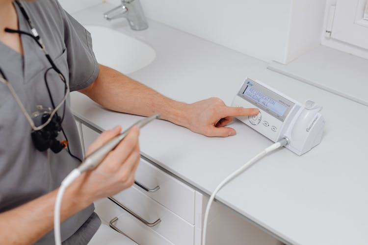 Close Up Of A Doctor With A Medical Instrument