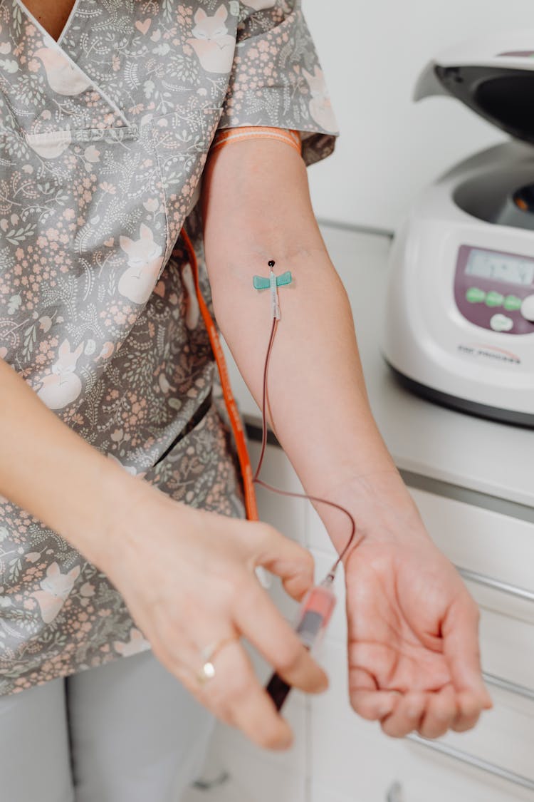 A Nurse Drawing Her Own Blood 