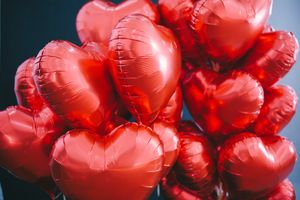 Red heart balloons, photo by Alesia Talkachova on Pexels