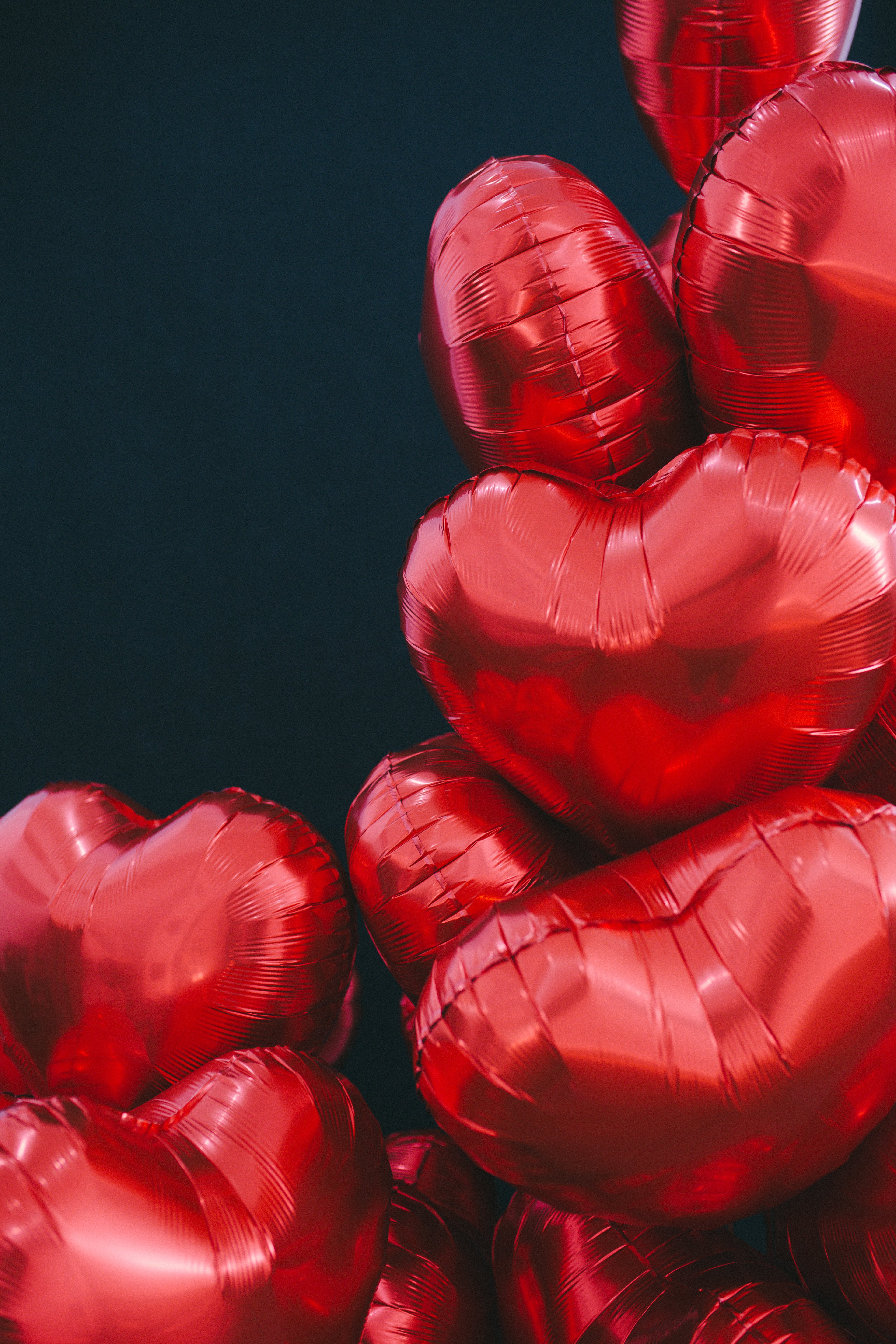 Red Heart Shaped Balloons on Black Background · Free Stock Photo