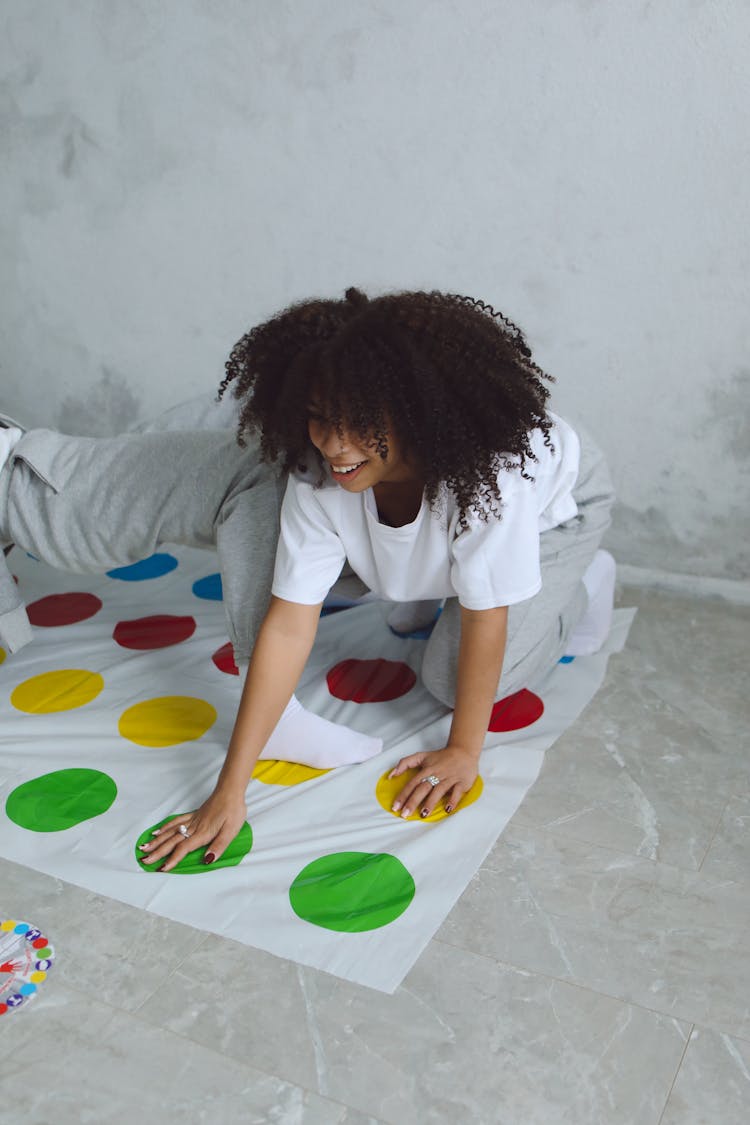 
A Woman Playing A Twister Game