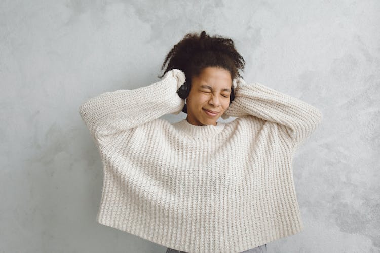 Woman Listening To A Headphone