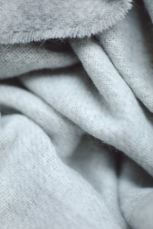Close-Up Photograph of White Textile