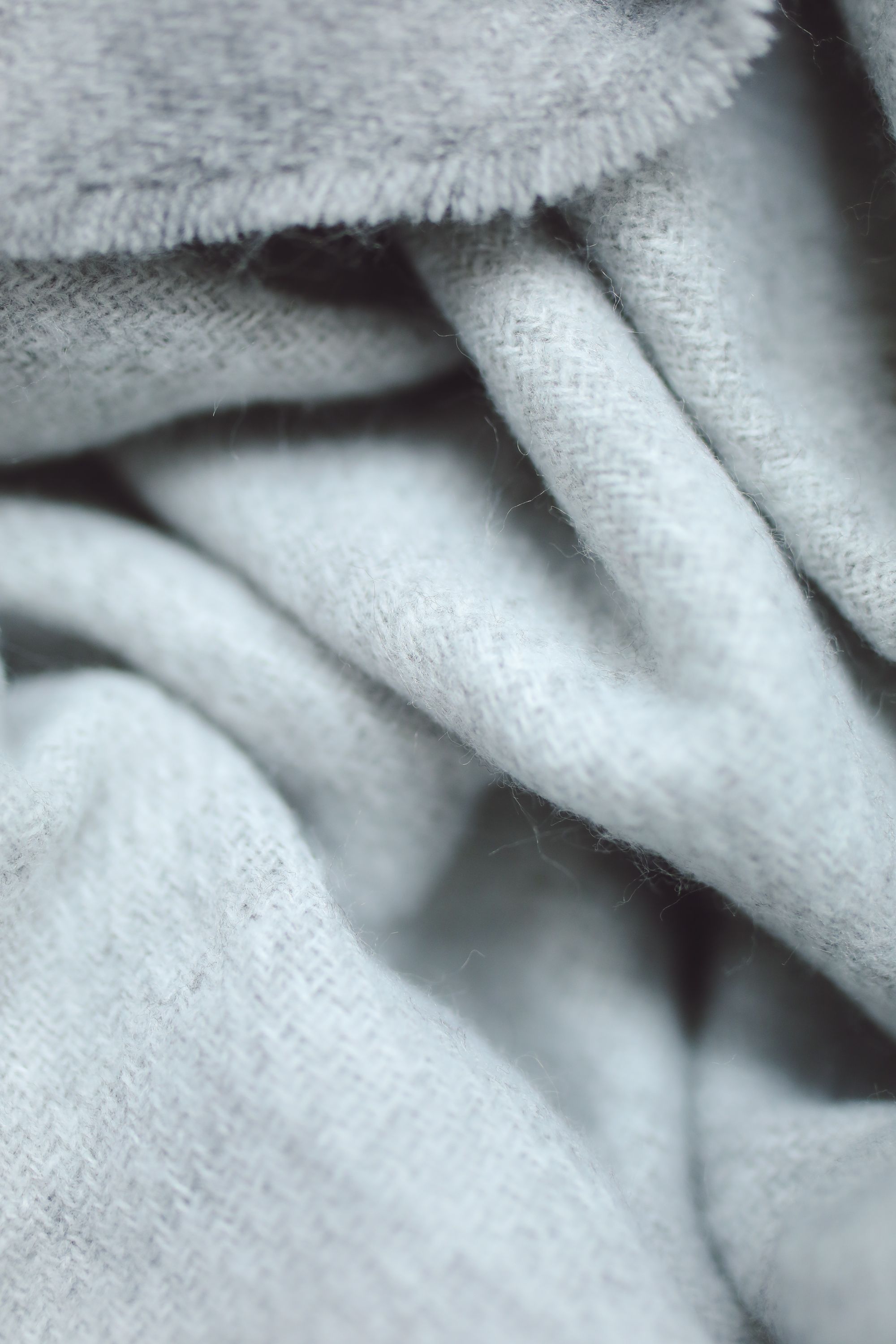 Close-up of soft pale knit fabric in gentle folds