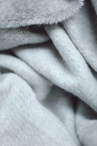 Soft cream wool-blend throw — photo by Polina Tankilevitch on Pexels