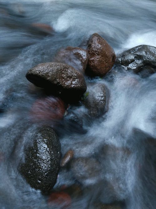 Close Up Shot of Rocks on the River