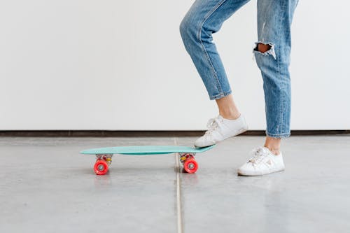 Free Photo of a Person Riding a Mint Penny Board Stock Photo