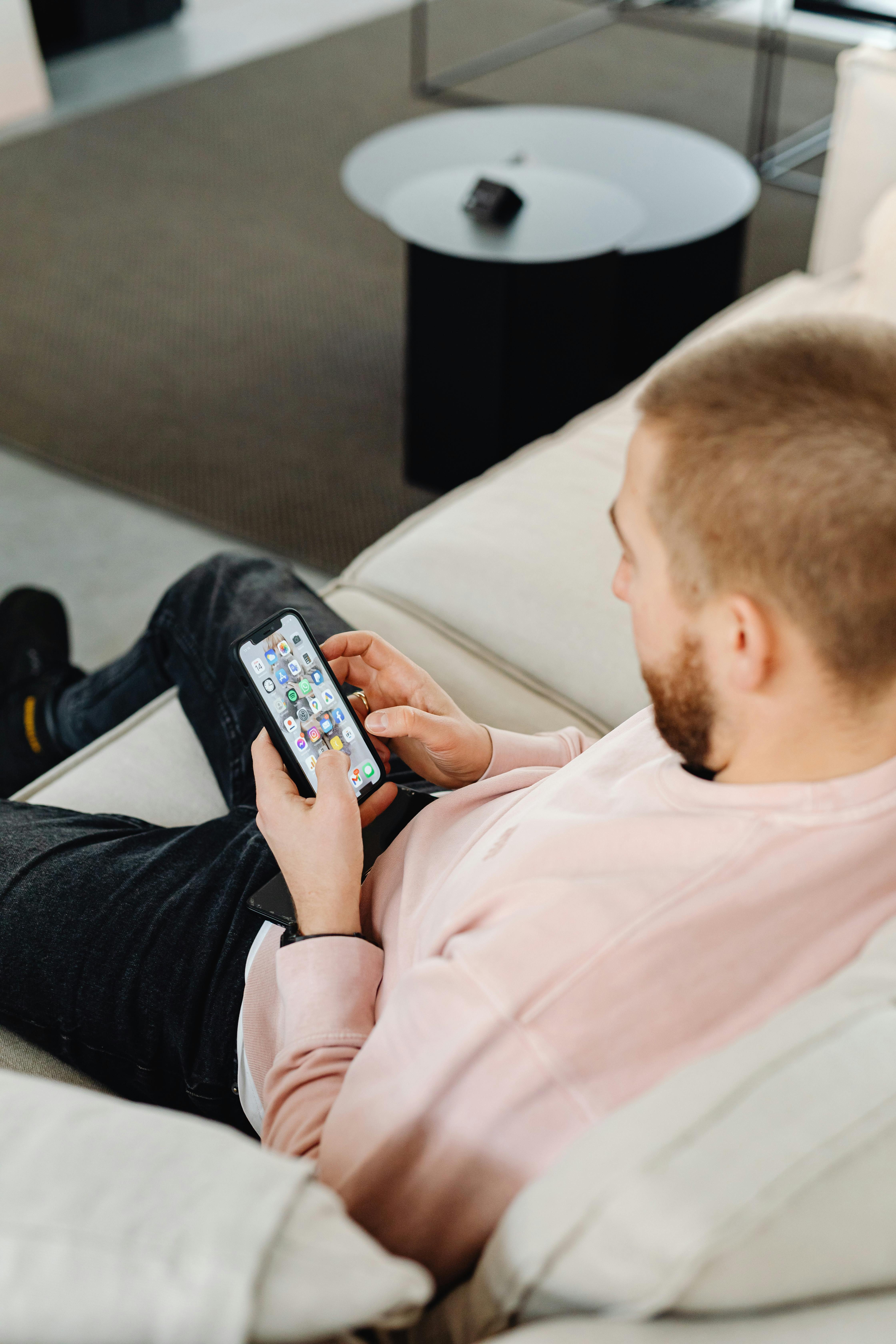 A Man Holding A Smartphone