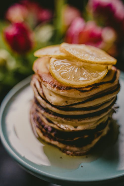 Free Slices of Lemon on Stack of Hotcakes Stock Photo