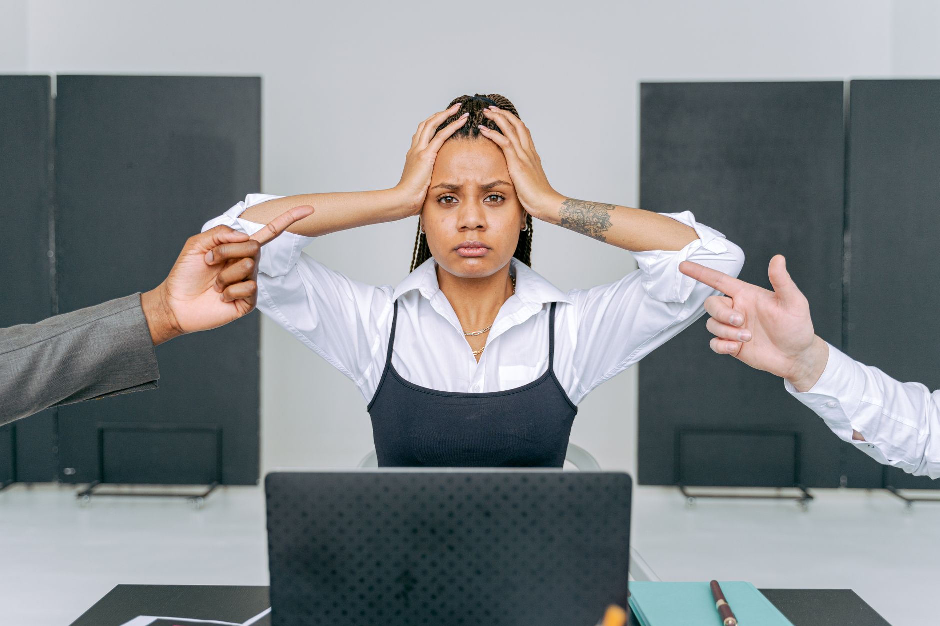 Stressed woman holding papers in an office