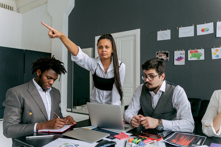 Woman Ordering Man At Work