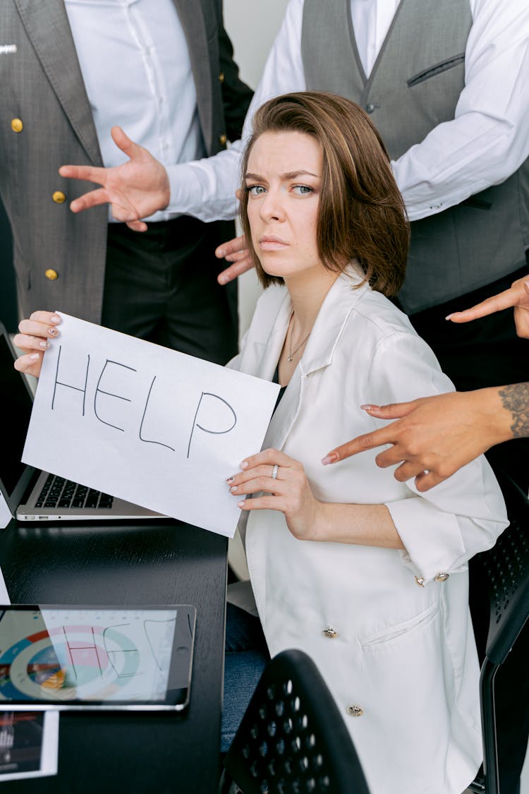 
A Woman Holding A Sign For Help