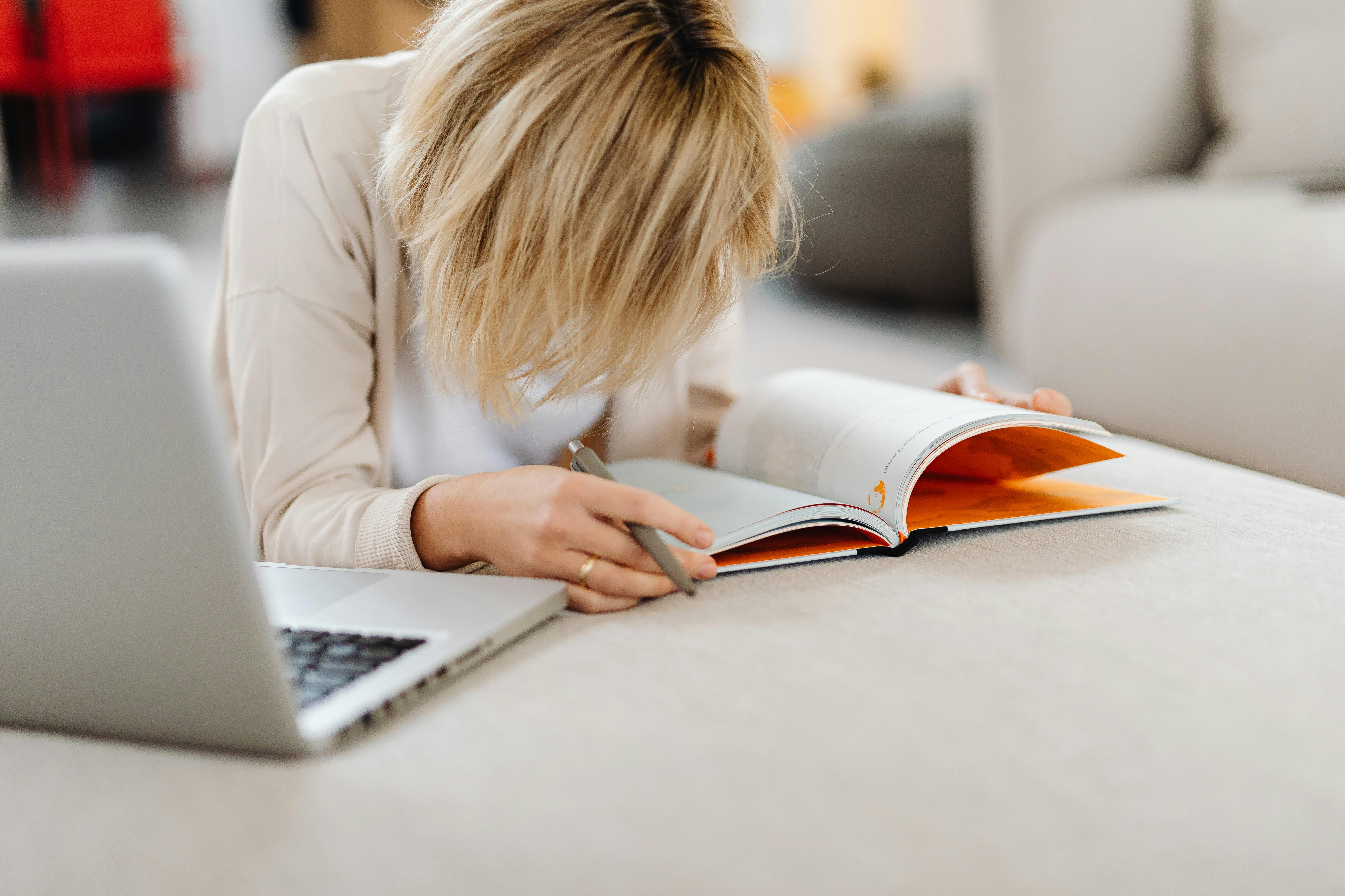 Tiny home dweller relaxing on a bean bag chair surrounded by compact furniture