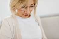 Woman in White Crew Neck Shirt Wearing Eyeglasses