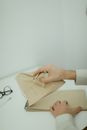 A Person Ripping and Crumpling a Paper