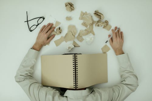 Free A Man Resting on a Table Stock Photo