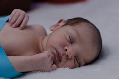 Close Up Photo Of A Sleeping Newborn Child 