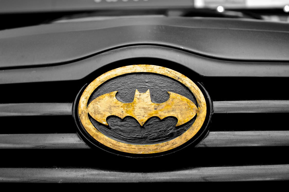 Black and Brown Batman Emblem Close-up Photography