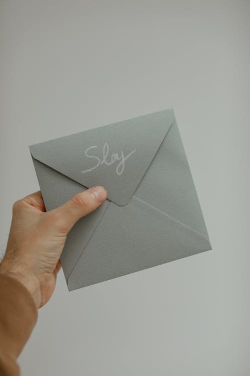 A Person Holding an Envelope