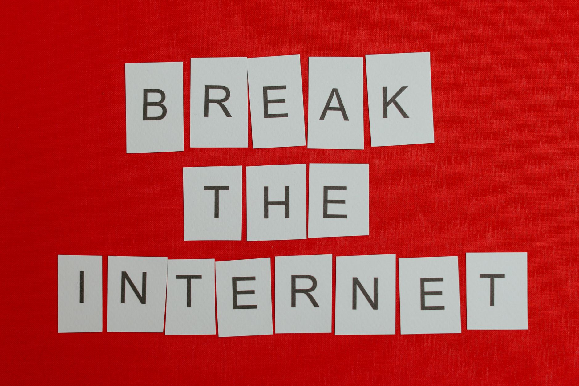 Inspirational message 'Break the Internet' displayed on a vibrant red background.
