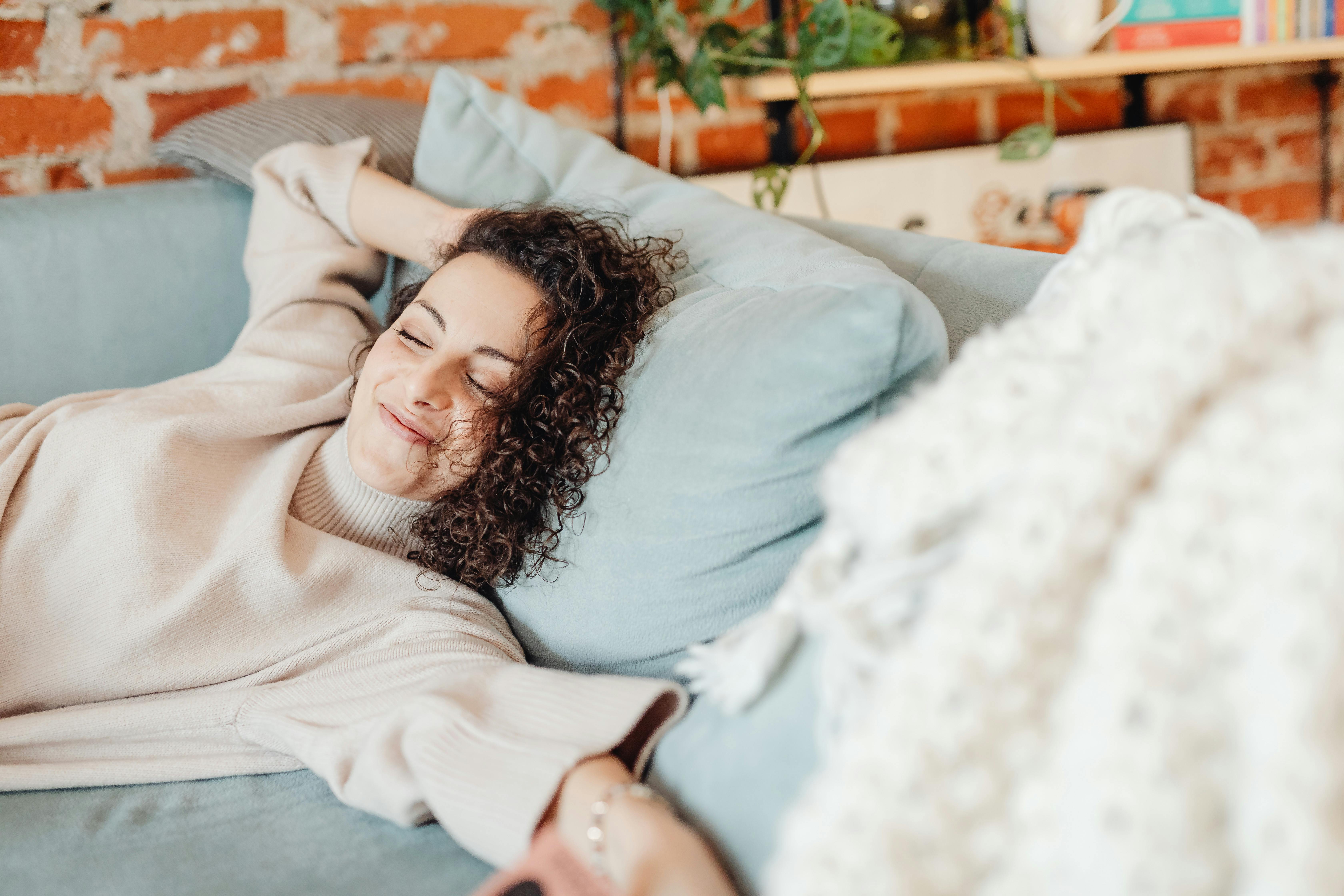 woman relaxing happily at home during a 30-day no spend challenge