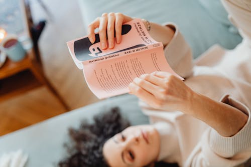 Free A Woman Reading a Book Stock Photo