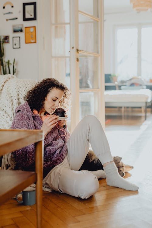 Young Woman Eating a Chocolate Cake at Home